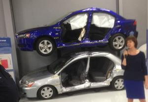 These cars illustrate good (blue car) and poor (silver car) side impact tests